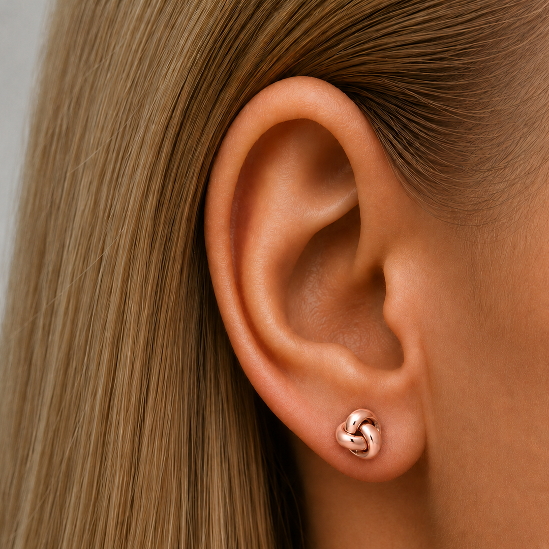 Pink Gold Love Knot Stud Earrings - worn on ear