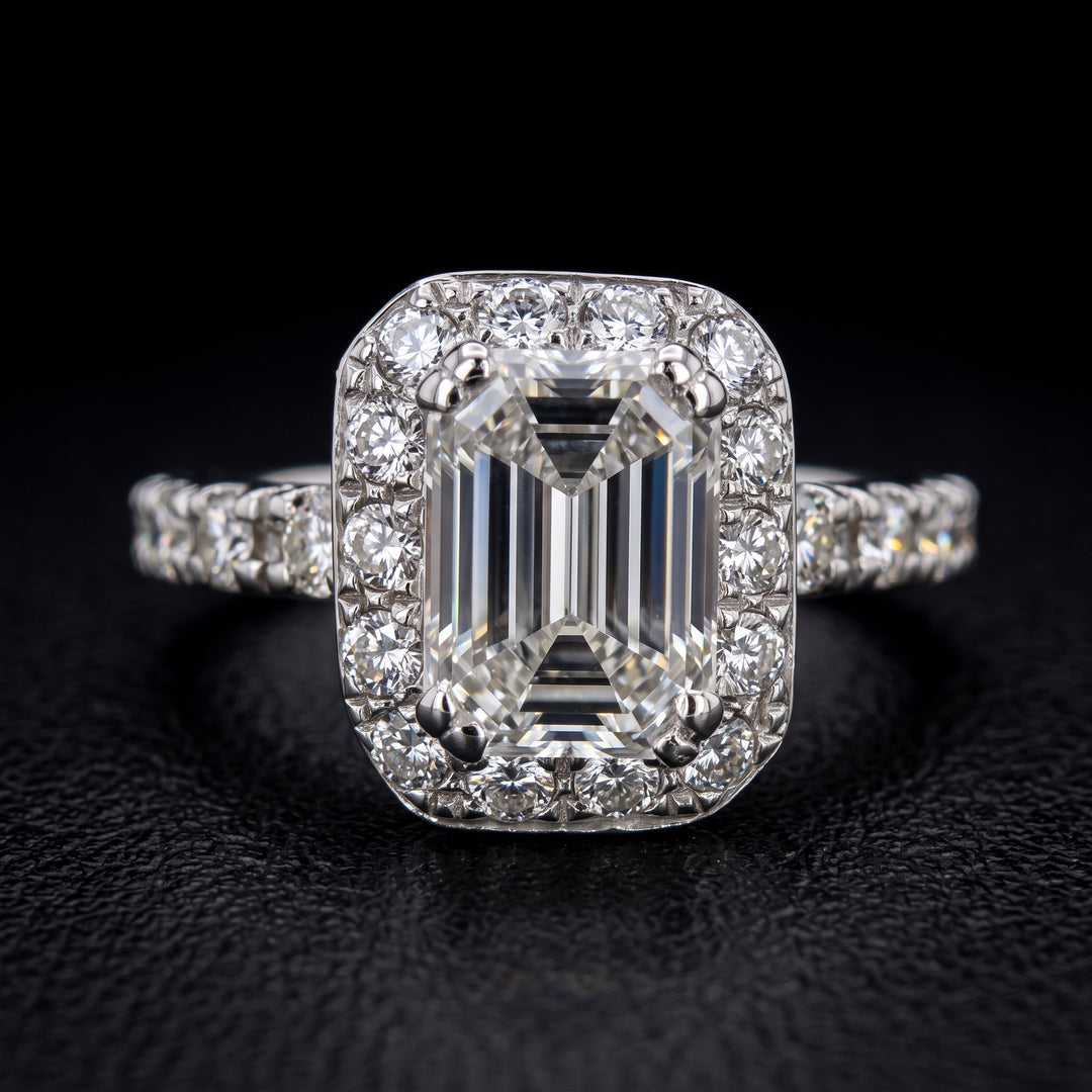 1.03 CT emerald-cut diamond halo engagement ring in 14K white gold with natural diamond accents.