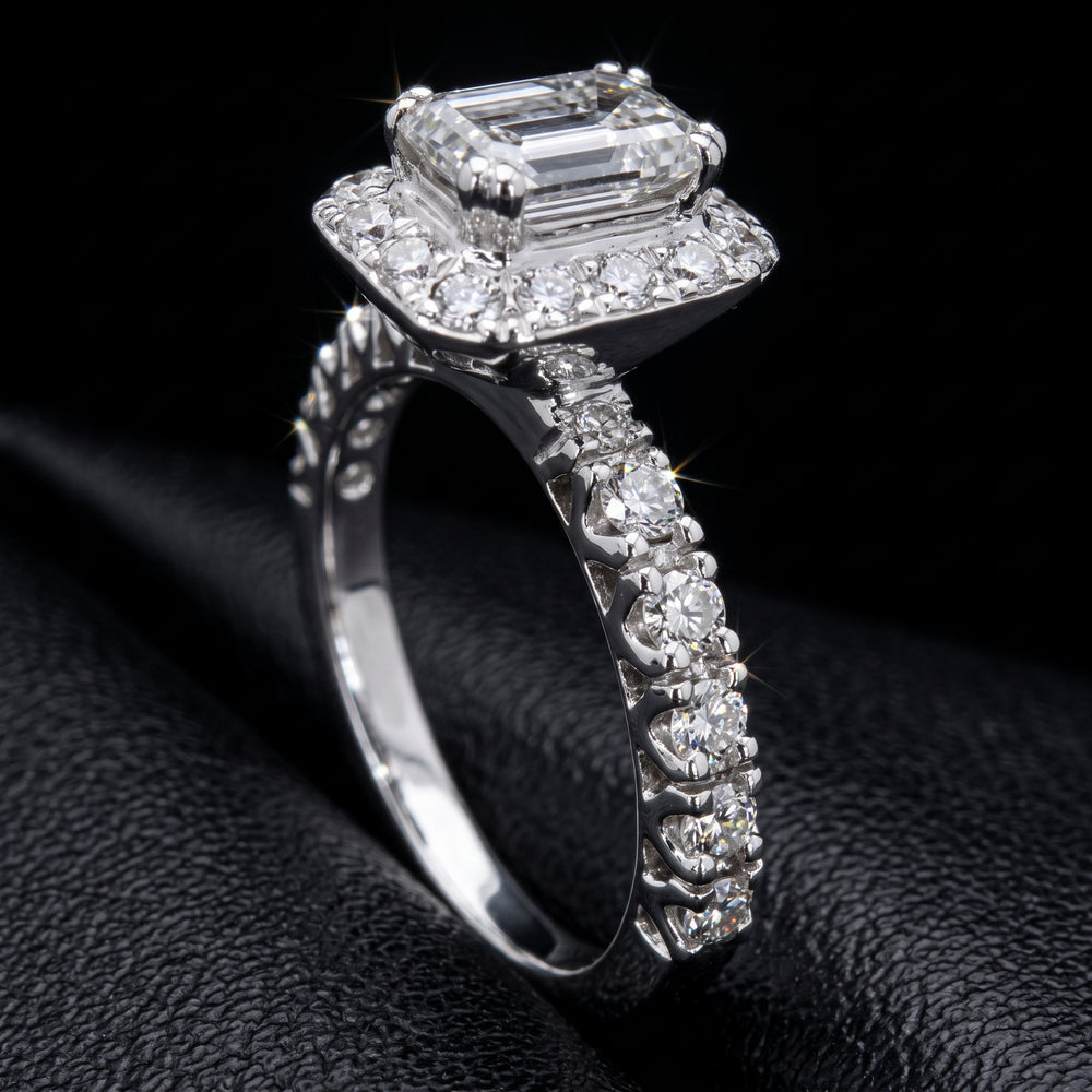 1.03 CT emerald-cut diamond halo engagement ring in 14K white gold with natural diamond accents.