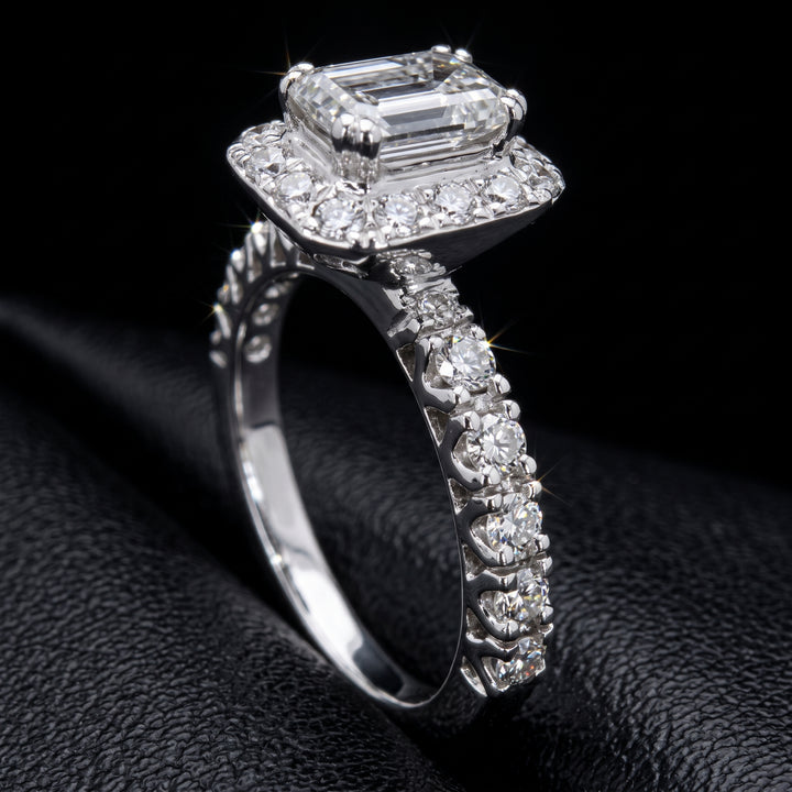 1.03 CT emerald-cut diamond halo engagement ring in 14K white gold with natural diamond accents.