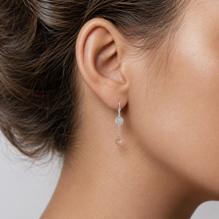 Pink And White Gold Diamond Cut Ball Drop Earrings - worn on ear