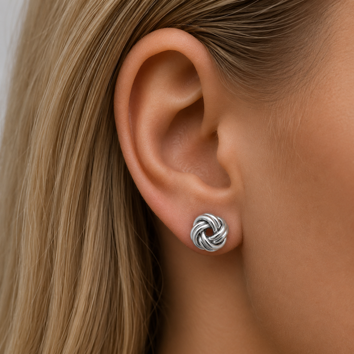 White Gold High Polish Love Knot Stud Earrings - worn on ear