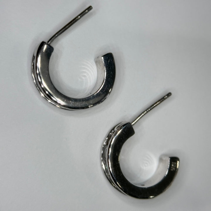 Back of the 14k white gold three-quarter hoops, polished gold and posts
