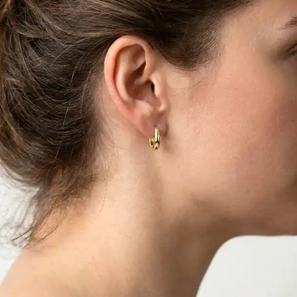Yellow Gold Oval Huggie Earrings - worn on ear