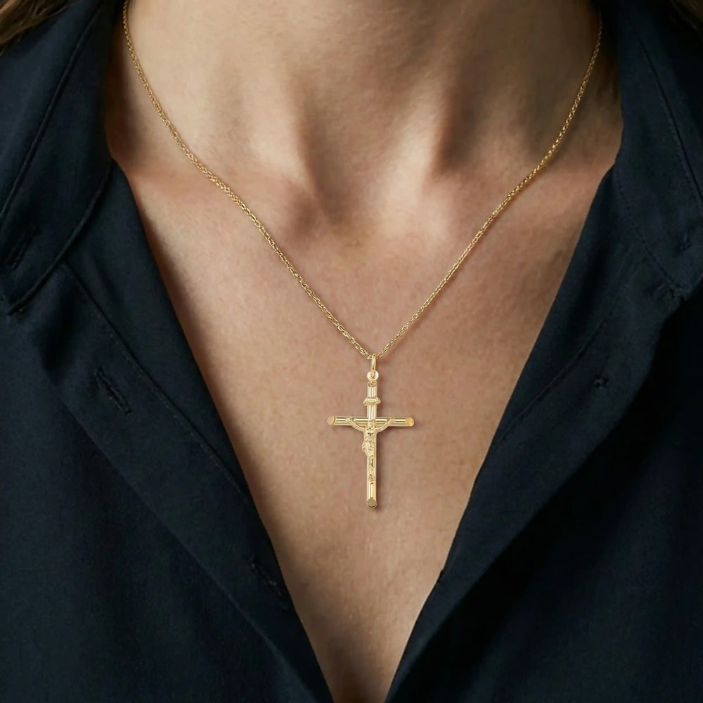 Tubular Crucifix Yellow Gold Cross Pendant worn on womens chest
