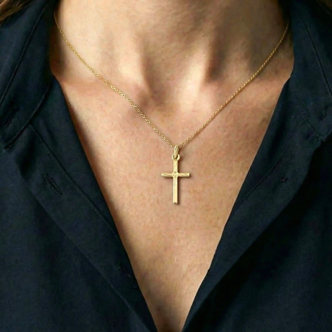 Engraved Latin Yellow Gold Cross Pendant worn on womens chest