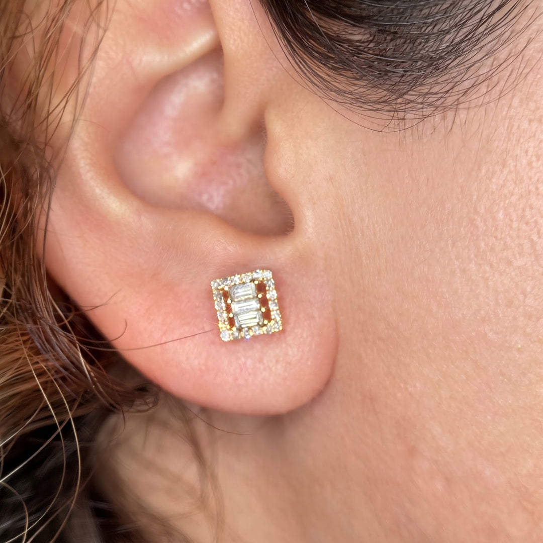 14k yellow gold natural diamond stud worn on the ear