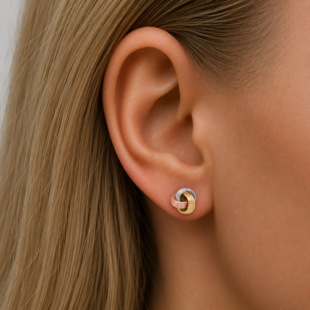 Two Tone Love Knot Stud Earrings - worn on ear