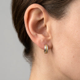 Two Tone Patterned Huggie Earrings - worn on ear