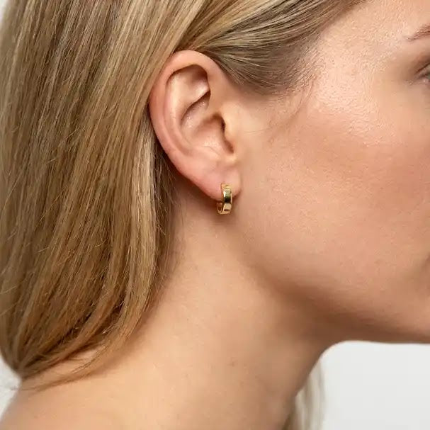 Yellow Gold Huggie Earrings - worn on ear