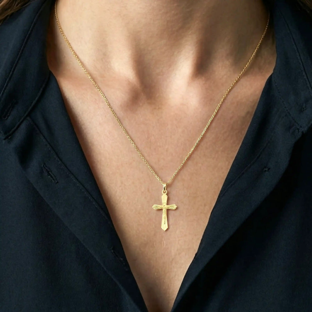 Flared Crucifix Yellow Gold Cross Pendant worn on womens chest