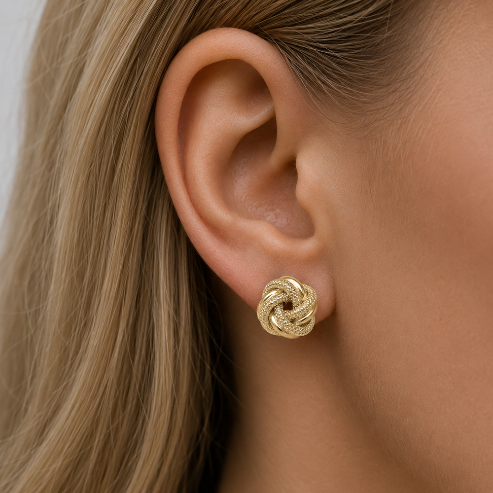 Yellow Gold Patterned Love Knot Earrings - worn on ear
