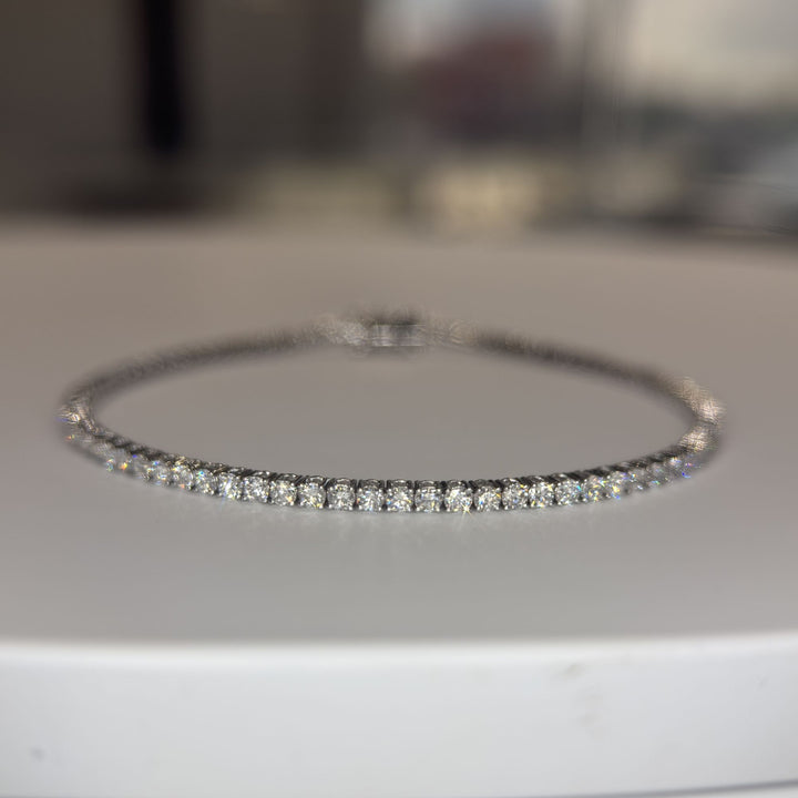 Round lab-grown diamond tennis bracelet, oval low-angle studio view
