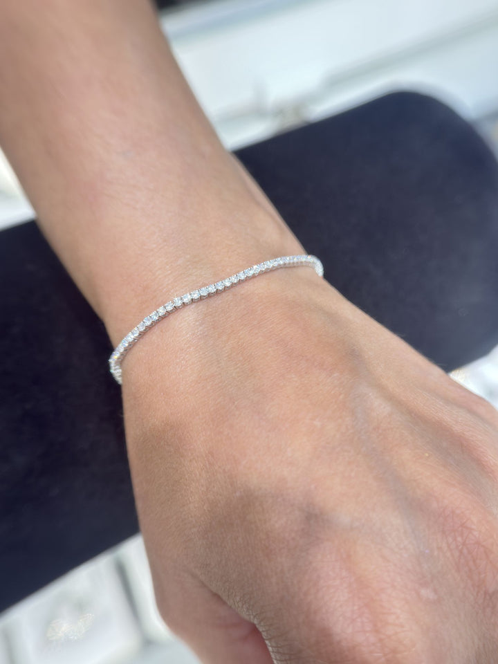 Round lab-grown diamond tennis bracelet shown on the wrist