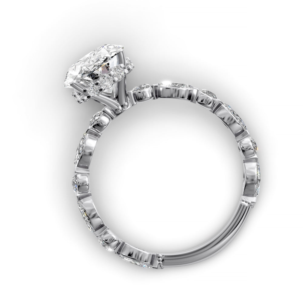 Oval hidden halo engagement ring with alternating marquise and round diamond band shown in studio lighting
