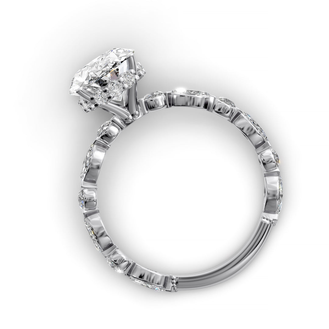Oval hidden halo engagement ring with alternating marquise and round diamond band shown in studio lighting
