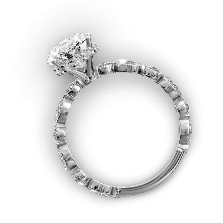 Oval hidden halo engagement ring with alternating marquise and round diamond band shown in studio lighting
