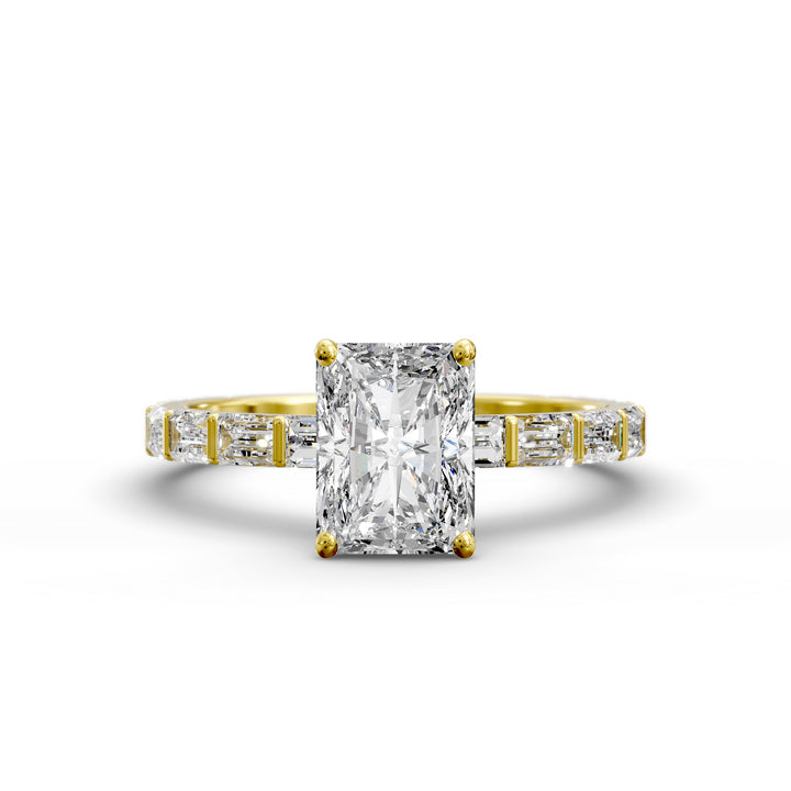 Radiant-cut diamond engagement ring with baguette diamond band shown in studio lighting.