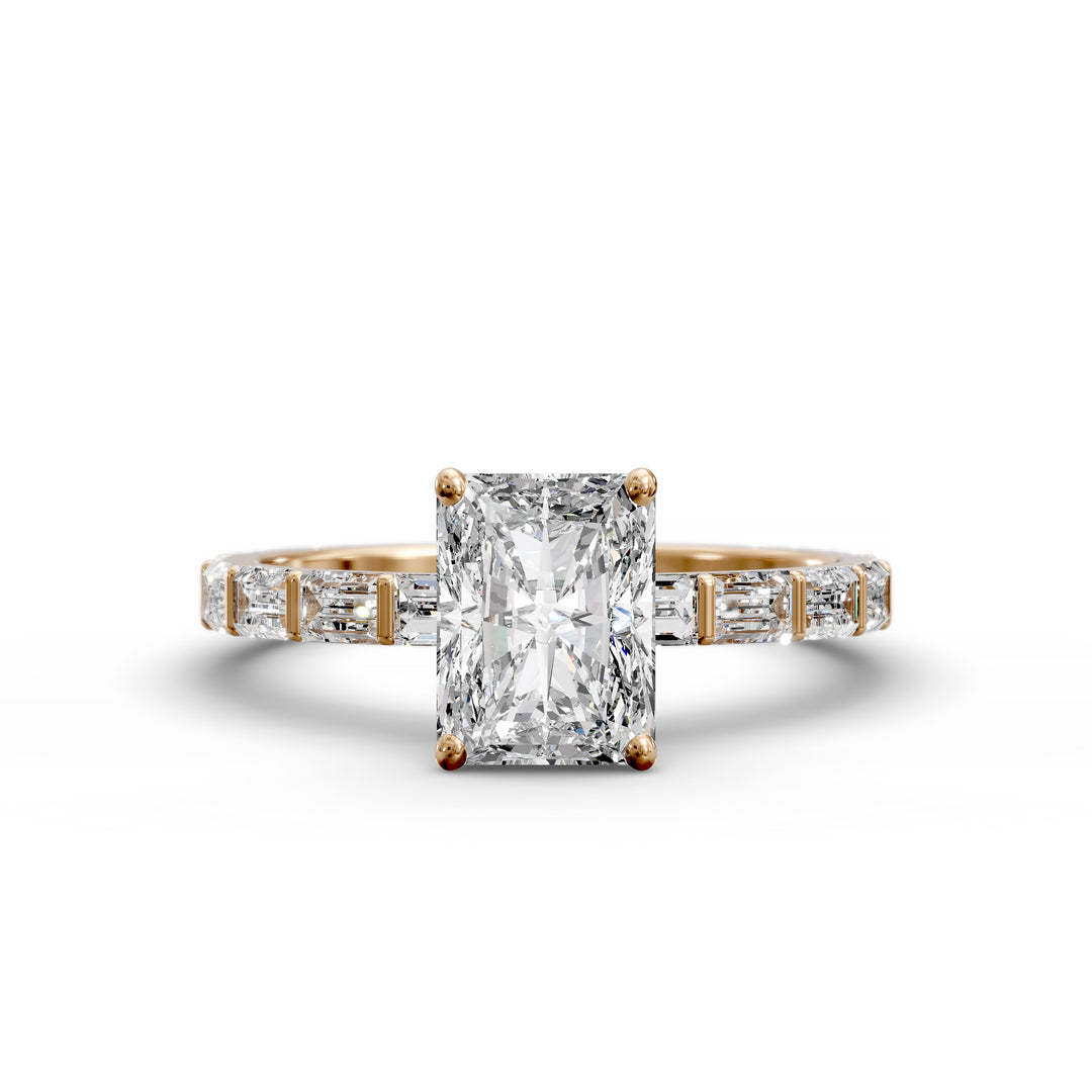 Radiant-cut diamond engagement ring with baguette diamond band shown in studio lighting.