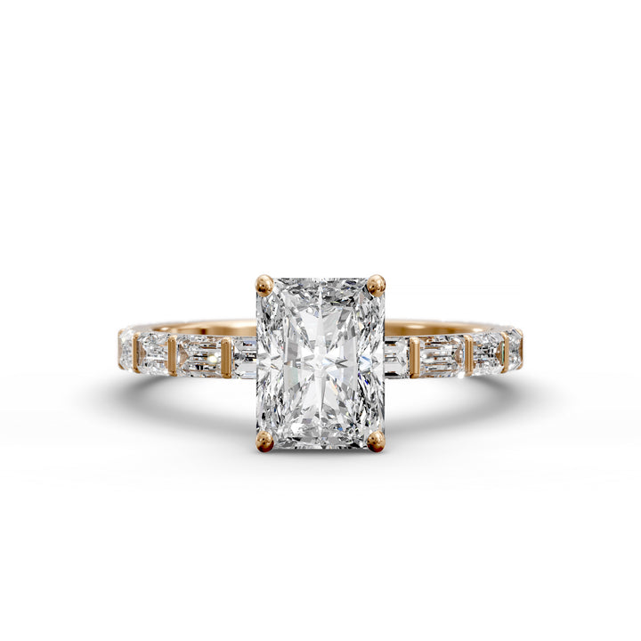 Radiant-cut diamond engagement ring with baguette diamond band shown in studio lighting.