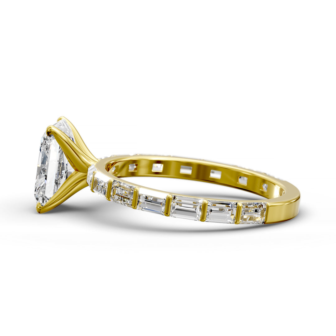 Radiant-cut diamond engagement ring with baguette diamond band shown in studio lighting.