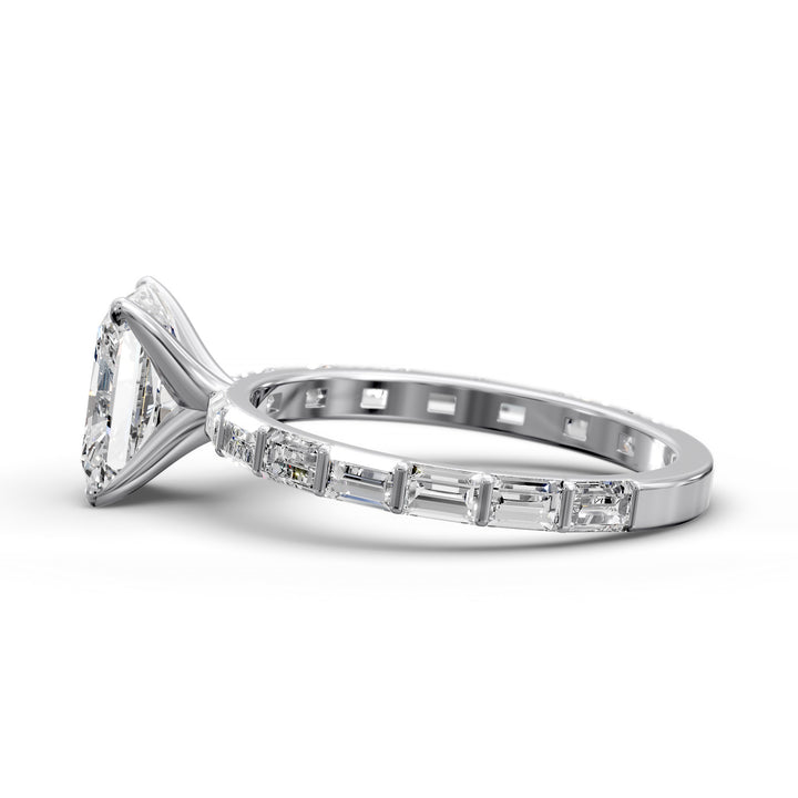 Radiant-cut diamond engagement ring with baguette diamond band shown in studio lighting.