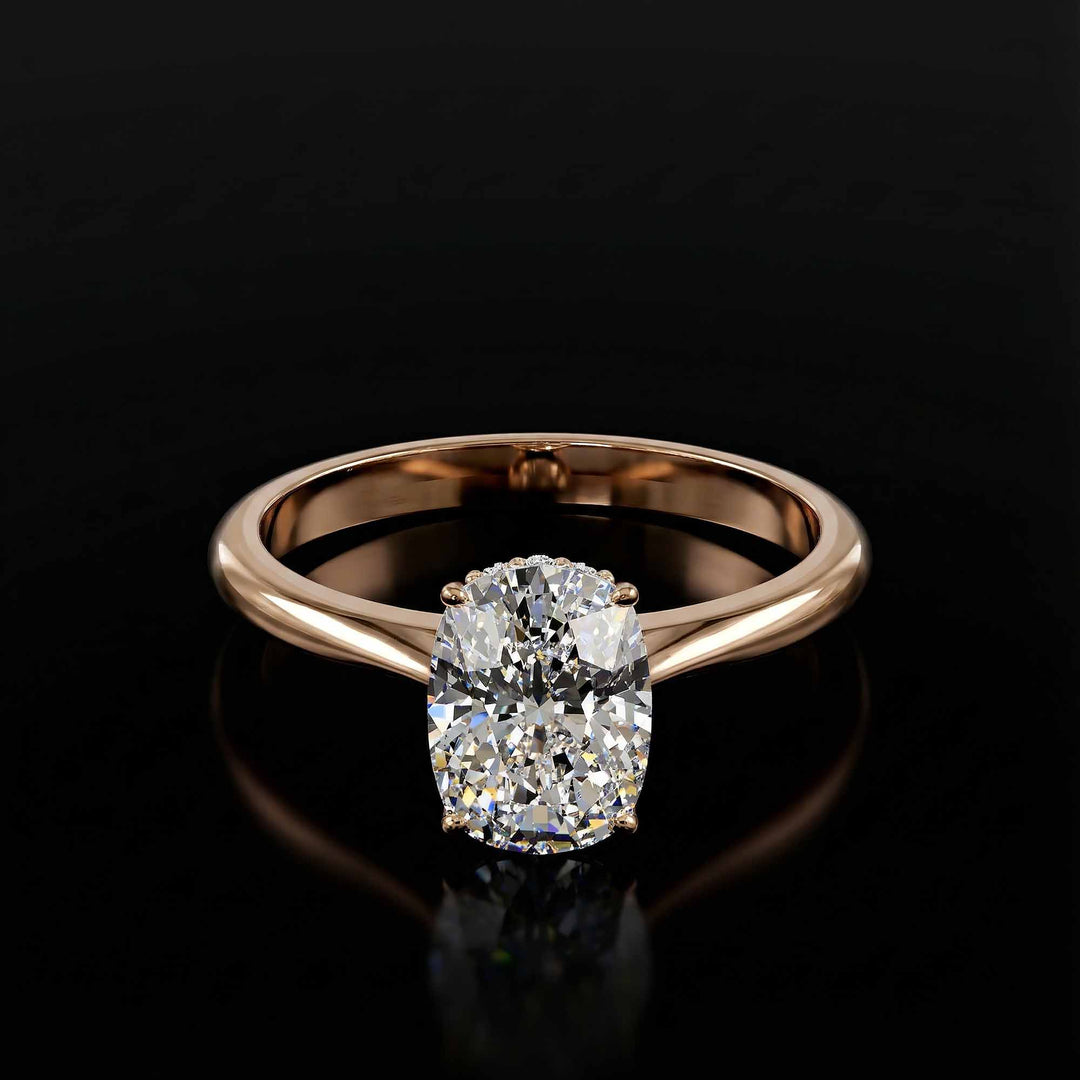 Elongated cushion diamond hidden halo cathedral engagement ring shown on display.
