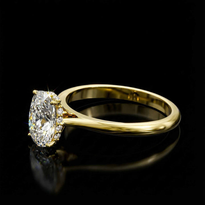 Elongated cushion diamond hidden halo cathedral engagement ring shown on display.
