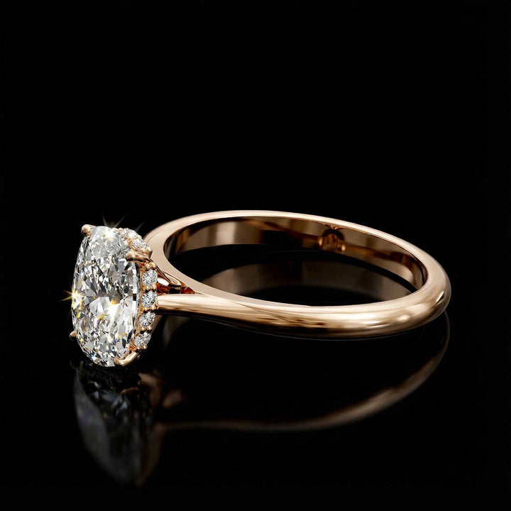 Elongated cushion diamond hidden halo cathedral engagement ring shown on display.
