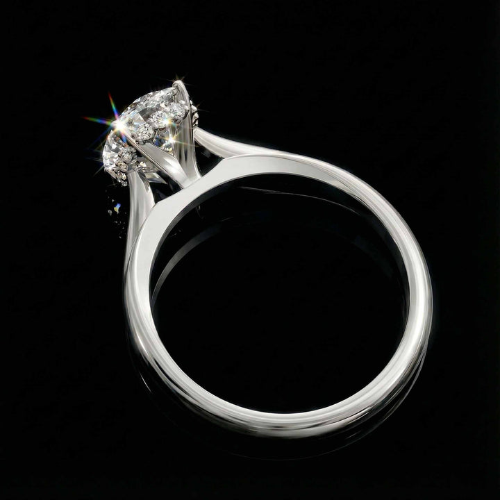 Elongated cushion diamond hidden halo cathedral engagement ring shown on display.