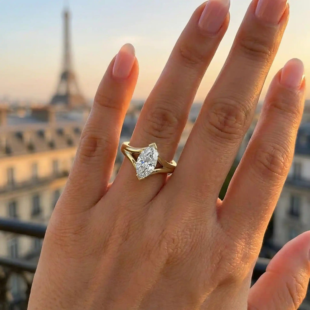 2 carat lab-grown marquise diamond split shank solitaire engagement ring displayed on hand.