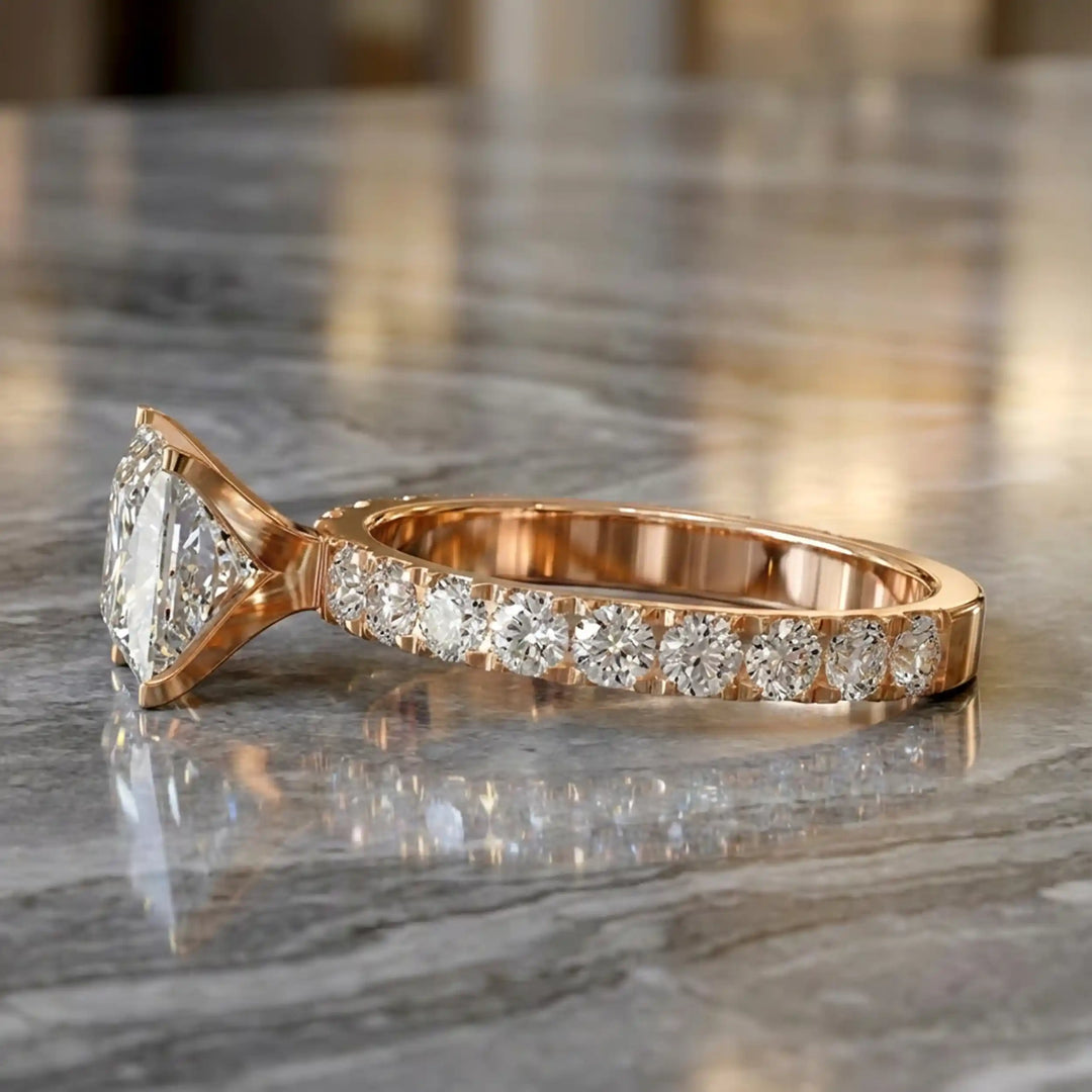 Princess cut lab diamond engagement ring with diamond band shown on marble display.