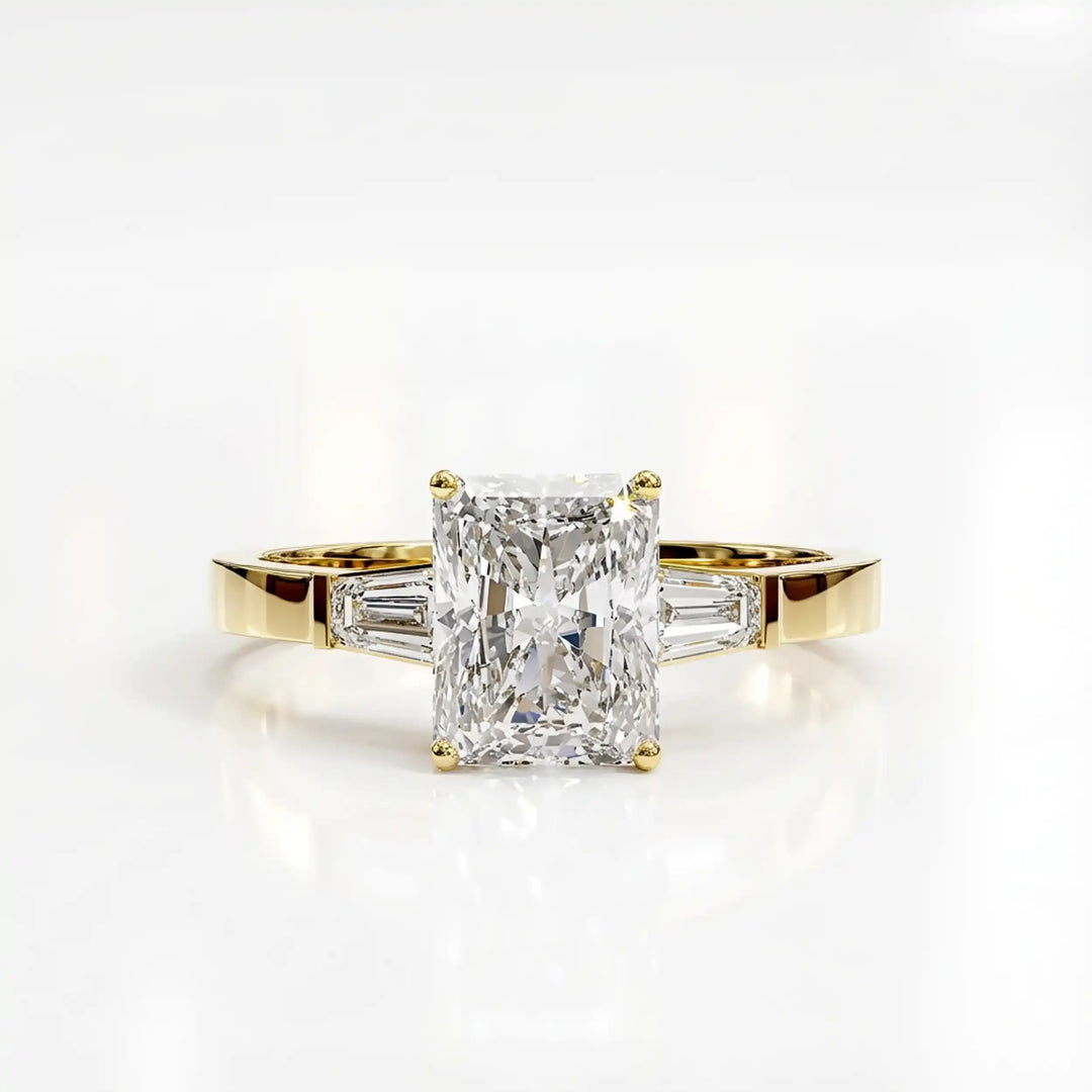 Radiant cut lab diamond three-stone engagement ring shown white surface.