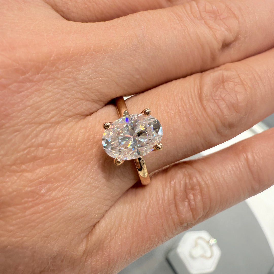 2.2 Ct oval solitaire moissanite engagement ring in 18K gold.