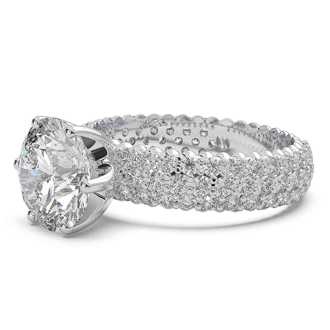 2.5 carat round diamond engagement ring with three rows of accent diamonds.