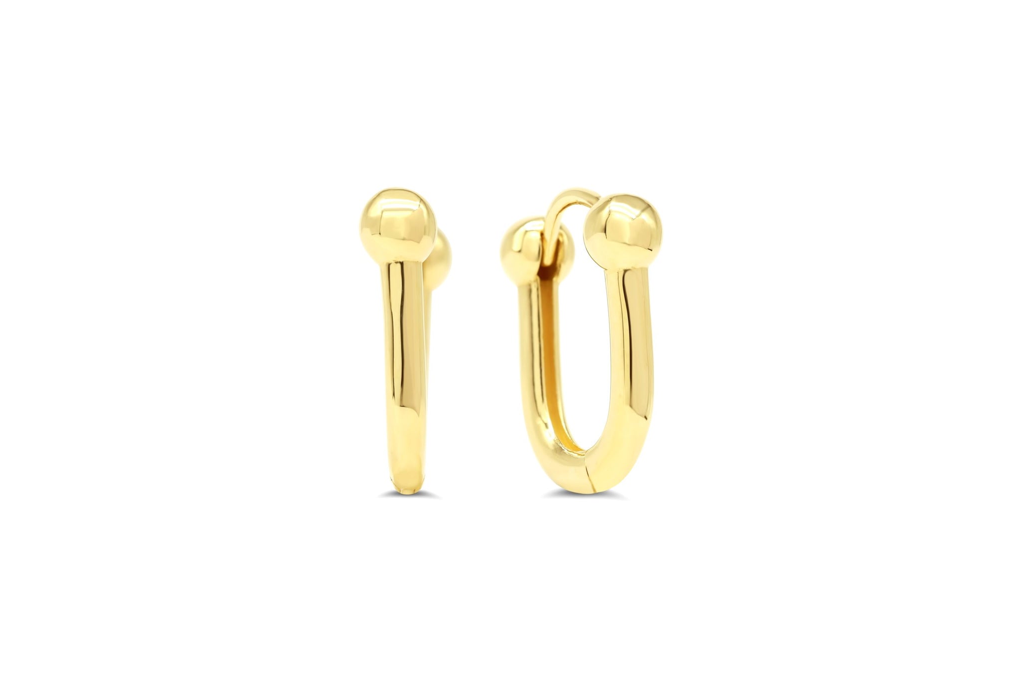 10k yellow gold huggie hoop earrings with bold ball accents and a polished finish.