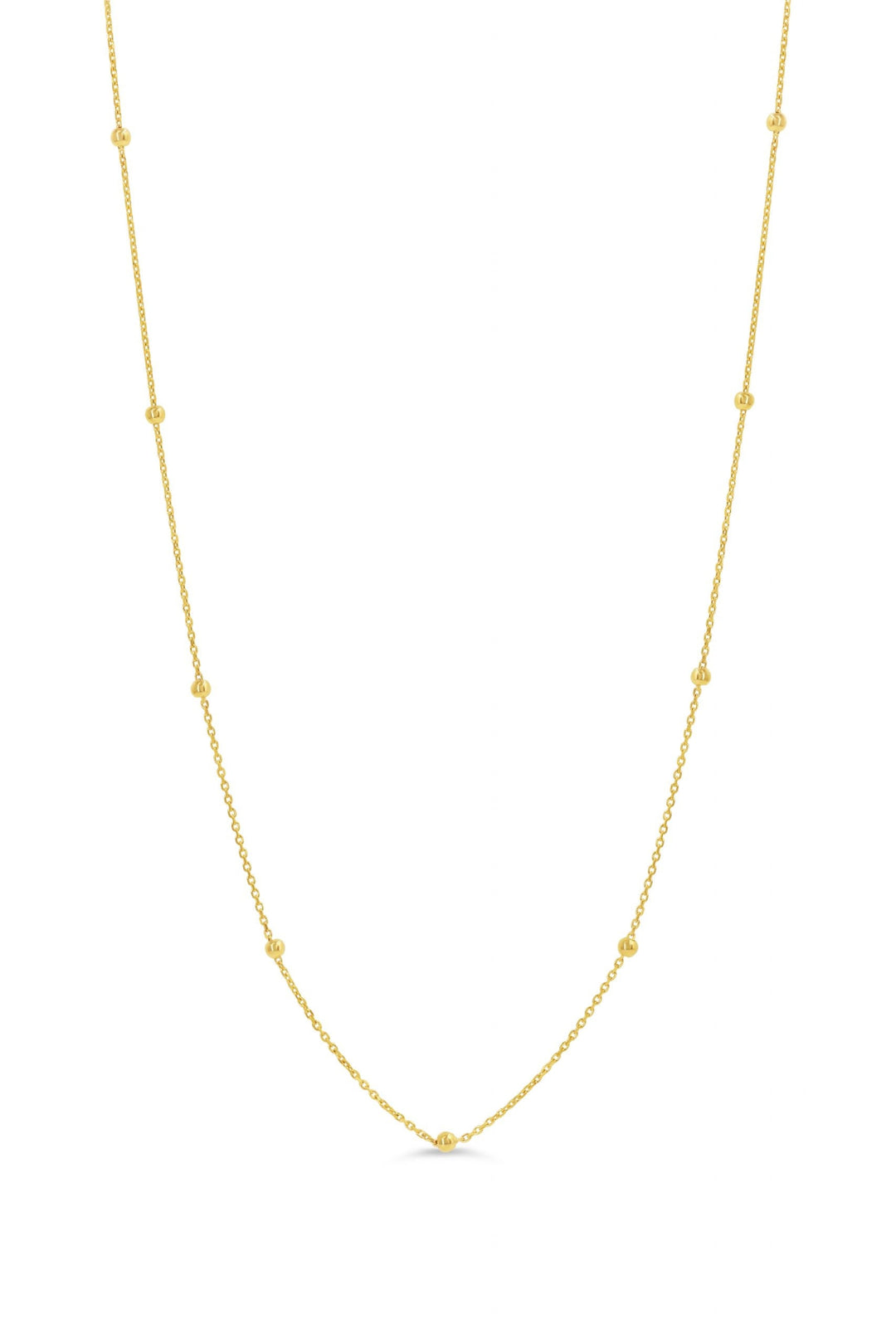 10K yellow gold station necklace with evenly spaced polished beads on a delicate chain.