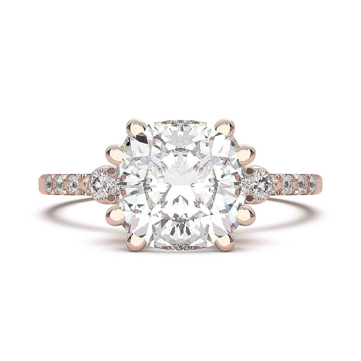 cushion-cut diamond engagement ring with pave-set diamond band and side stones