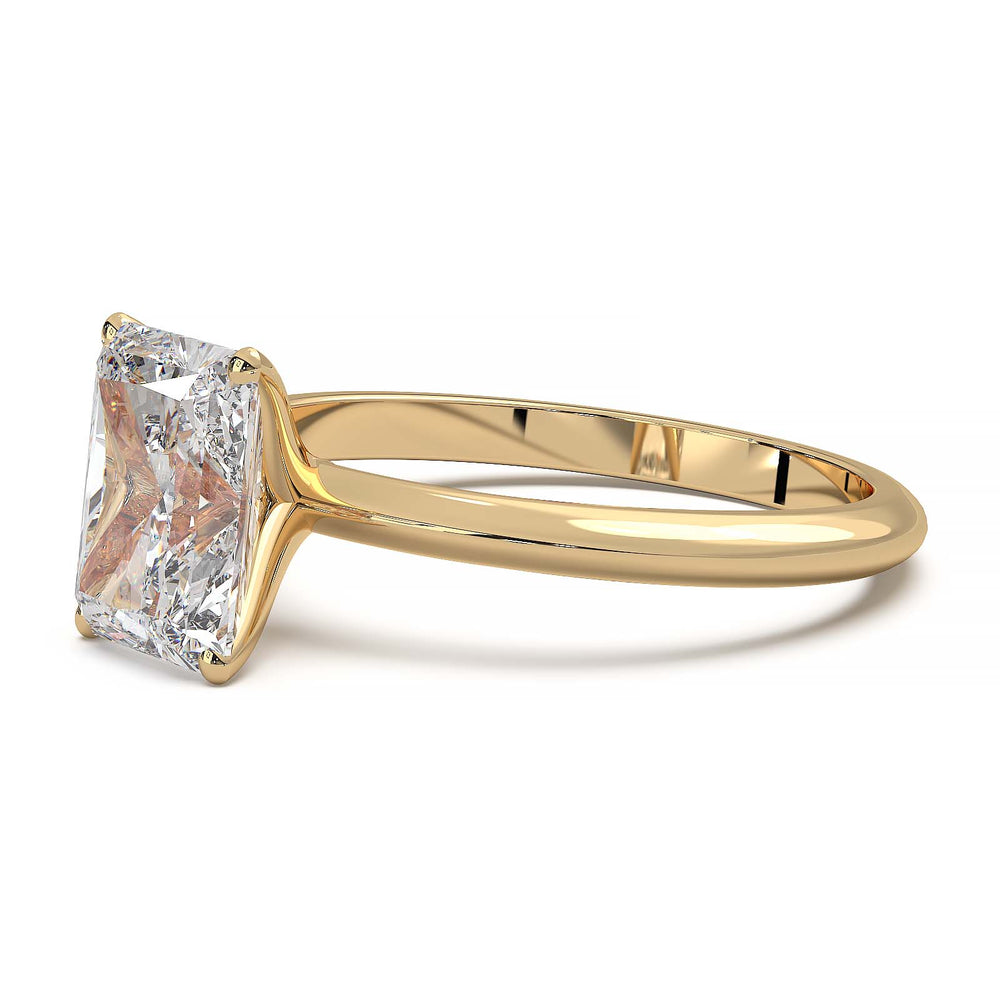 Radiant cut lab diamond solitaire ring with a low-profile setting and custom prongs.