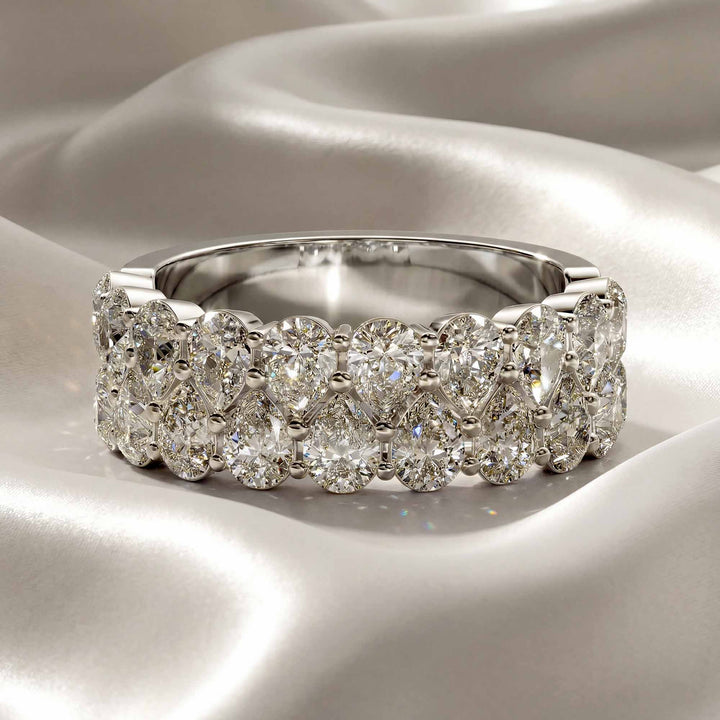 2.6 carat total round lab-grown diamond double row wedding band displayed on silk fabric.