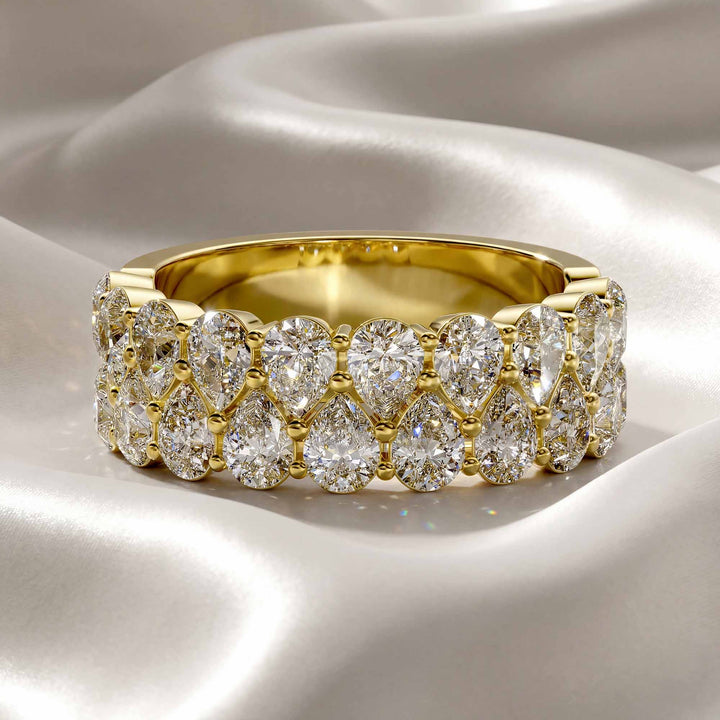 2.6 carat total round lab-grown diamond double row wedding band displayed on silk fabric.