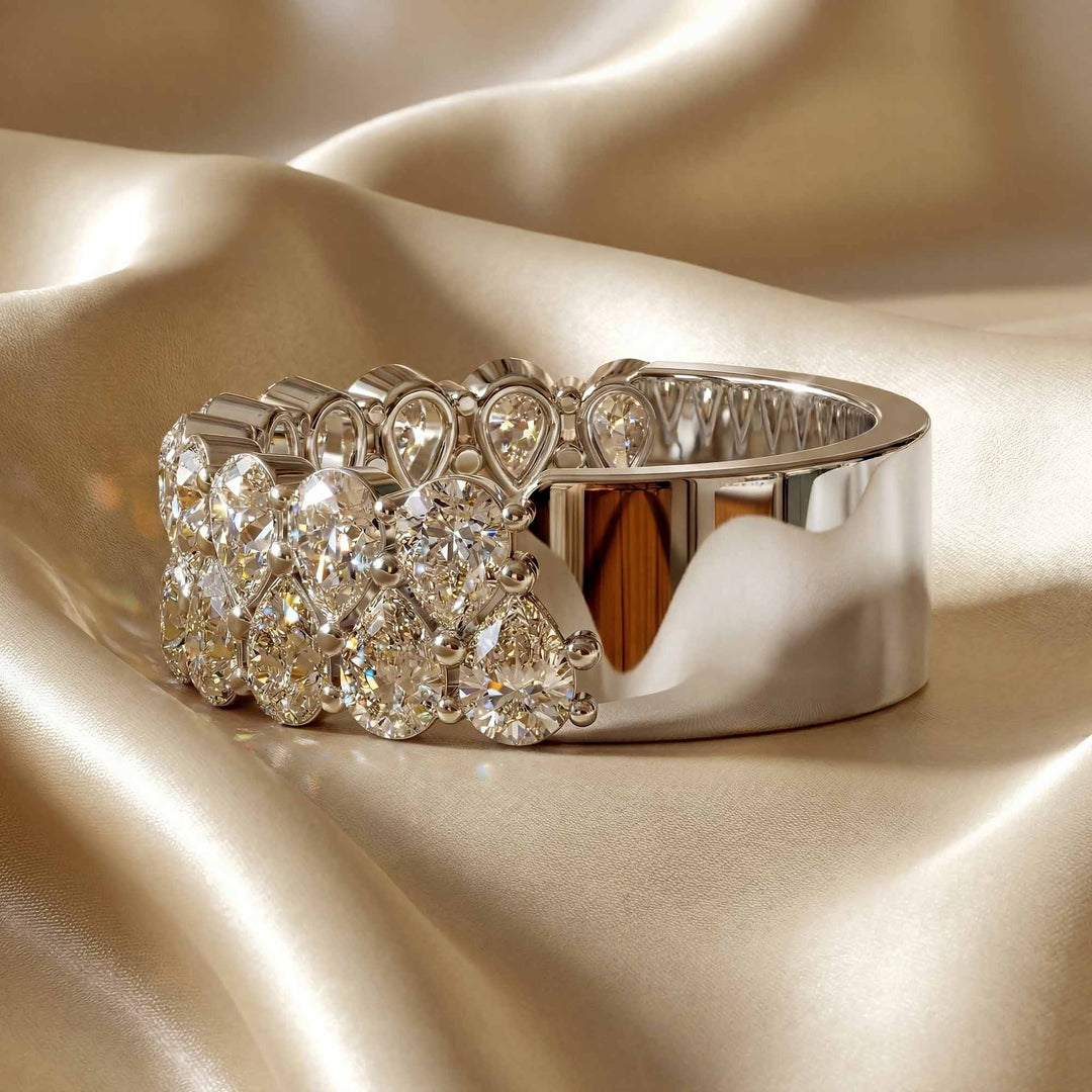 2.6 carat total round lab-grown diamond double row wedding band displayed on silk fabric.