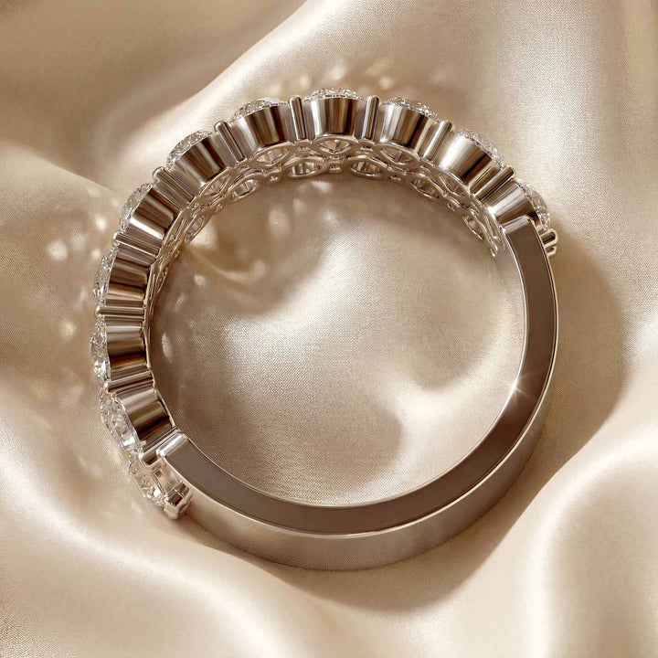 2.6 carat total round lab-grown diamond double row wedding band displayed on silk fabric.
