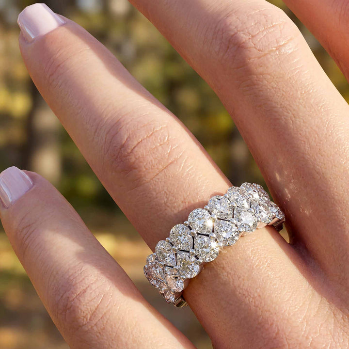 2.6 carat total round lab-grown diamond double row wedding band displayed on hand.
