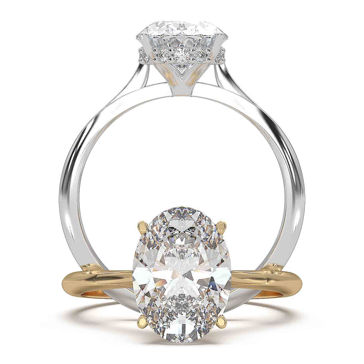 Oval diamond hidden halo engagement ring with cathedral setting and elegant prongs.