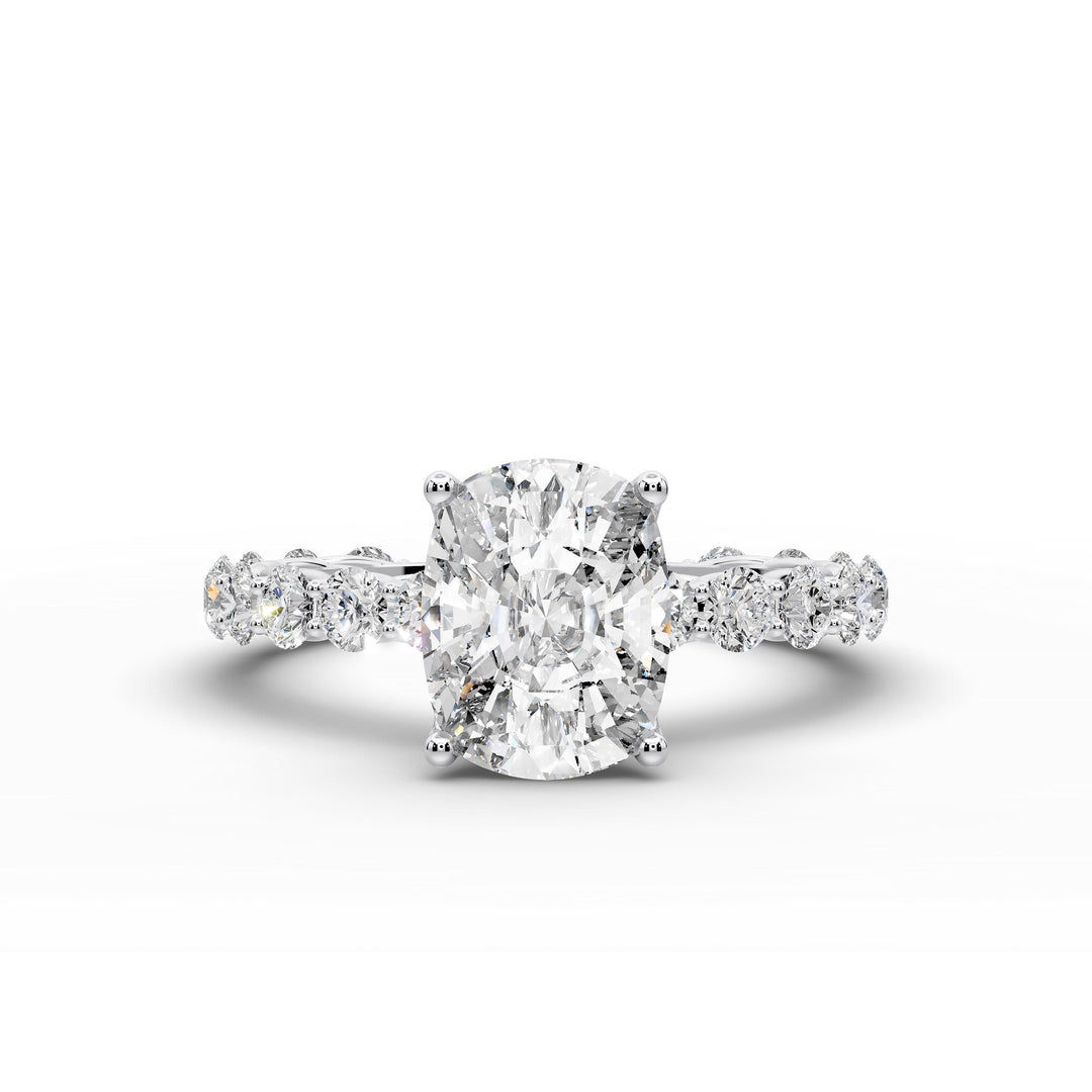 Elongated cushion diamond engagement ring with shared prong band shown in a studio display.