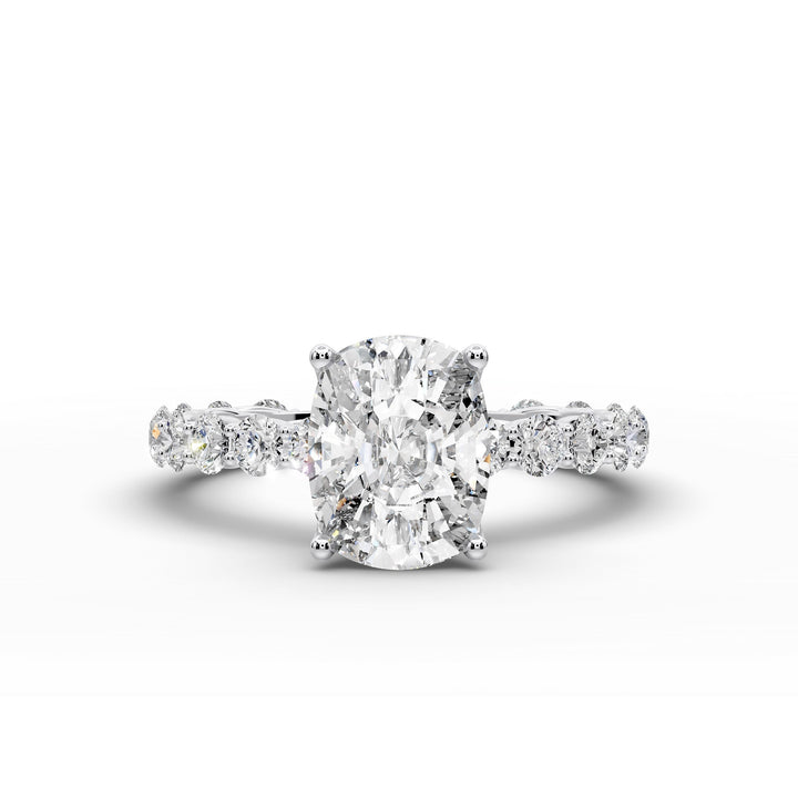 Elongated cushion diamond engagement ring with shared prong band shown in a studio display.
