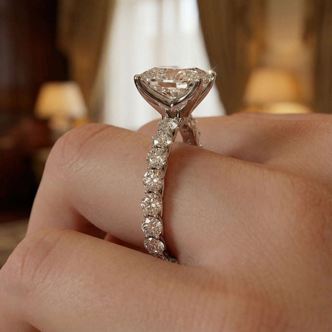 Elongated cushion diamond engagement ring with shared prong band shown in a studio display.