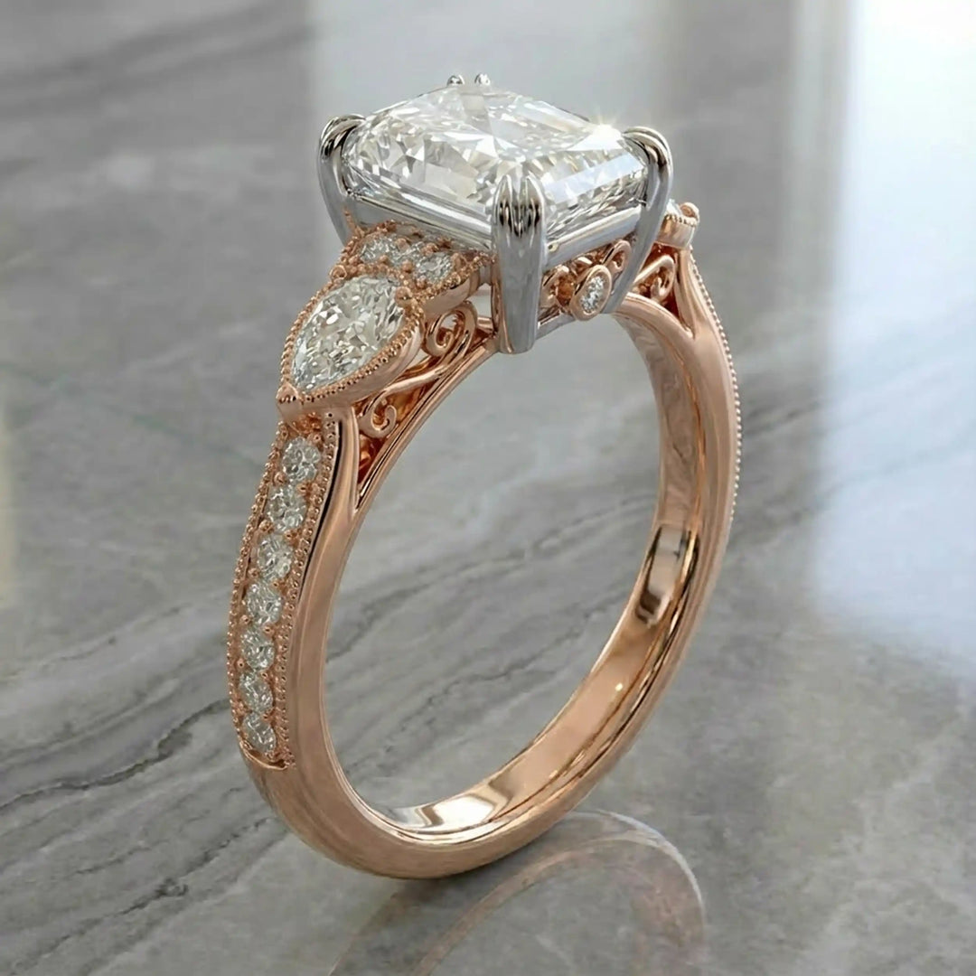 Radiant lab-grown diamond engagement ring with pear side stones displayed on ring stand.
