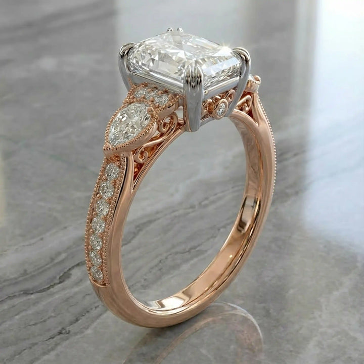 Radiant lab-grown diamond engagement ring with pear side stones displayed on ring stand.
